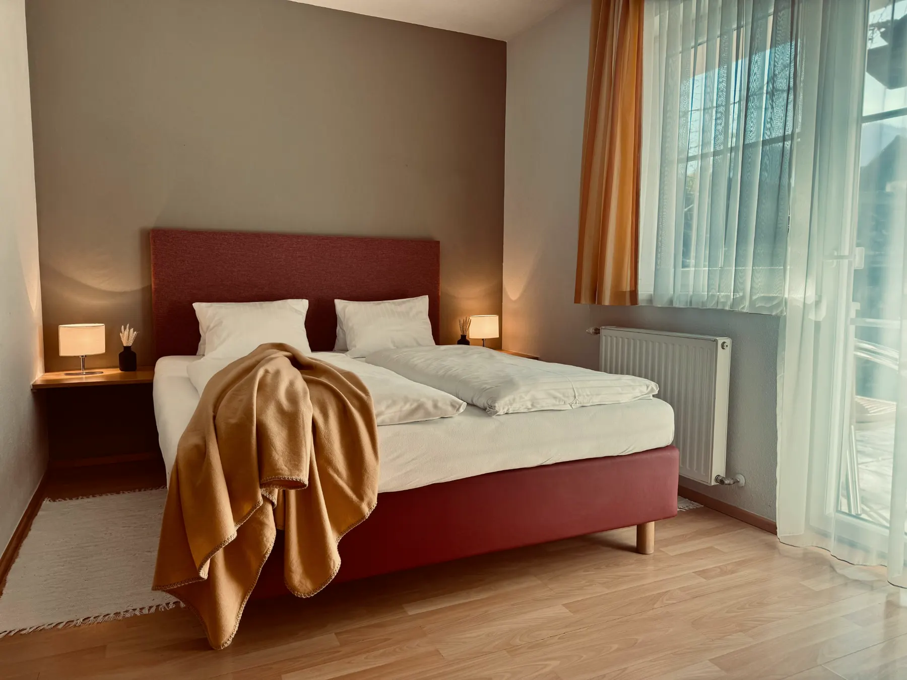 Double bed facing the balcony door