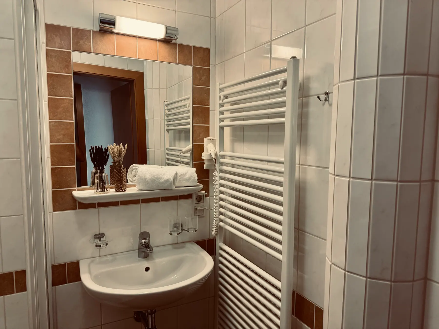 Bathroom with heated towel rail