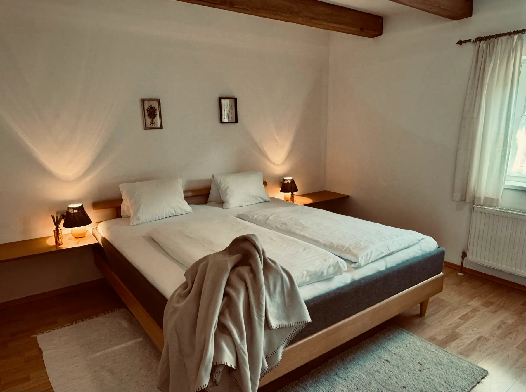 Bedroom beneath wooden beams